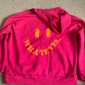 Pink hoodie with a cute graphic on the back